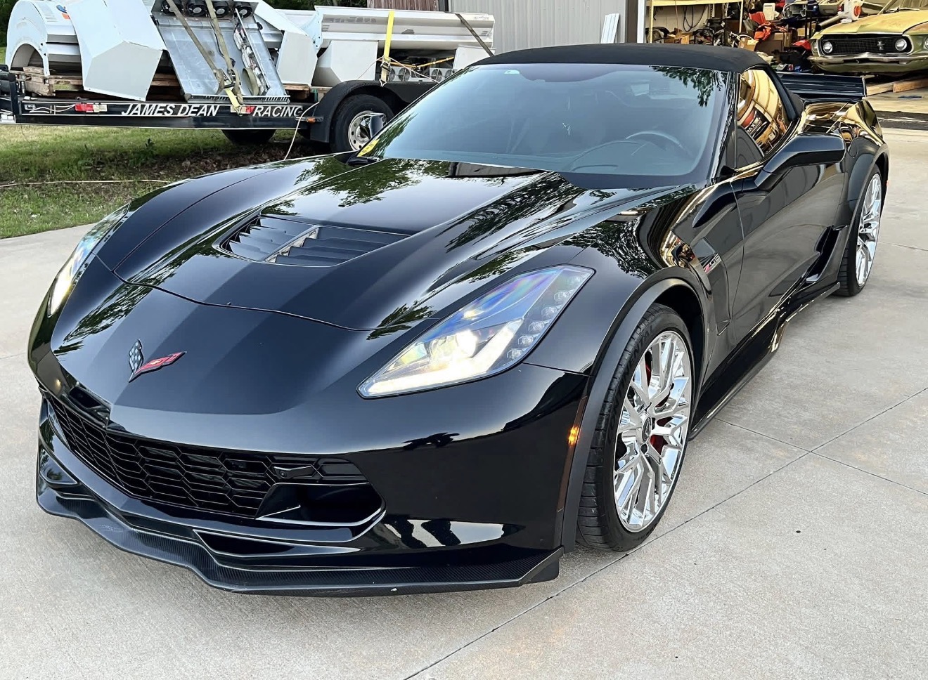 Black Chevrolet Corvette Z06 convertible outside the shop
